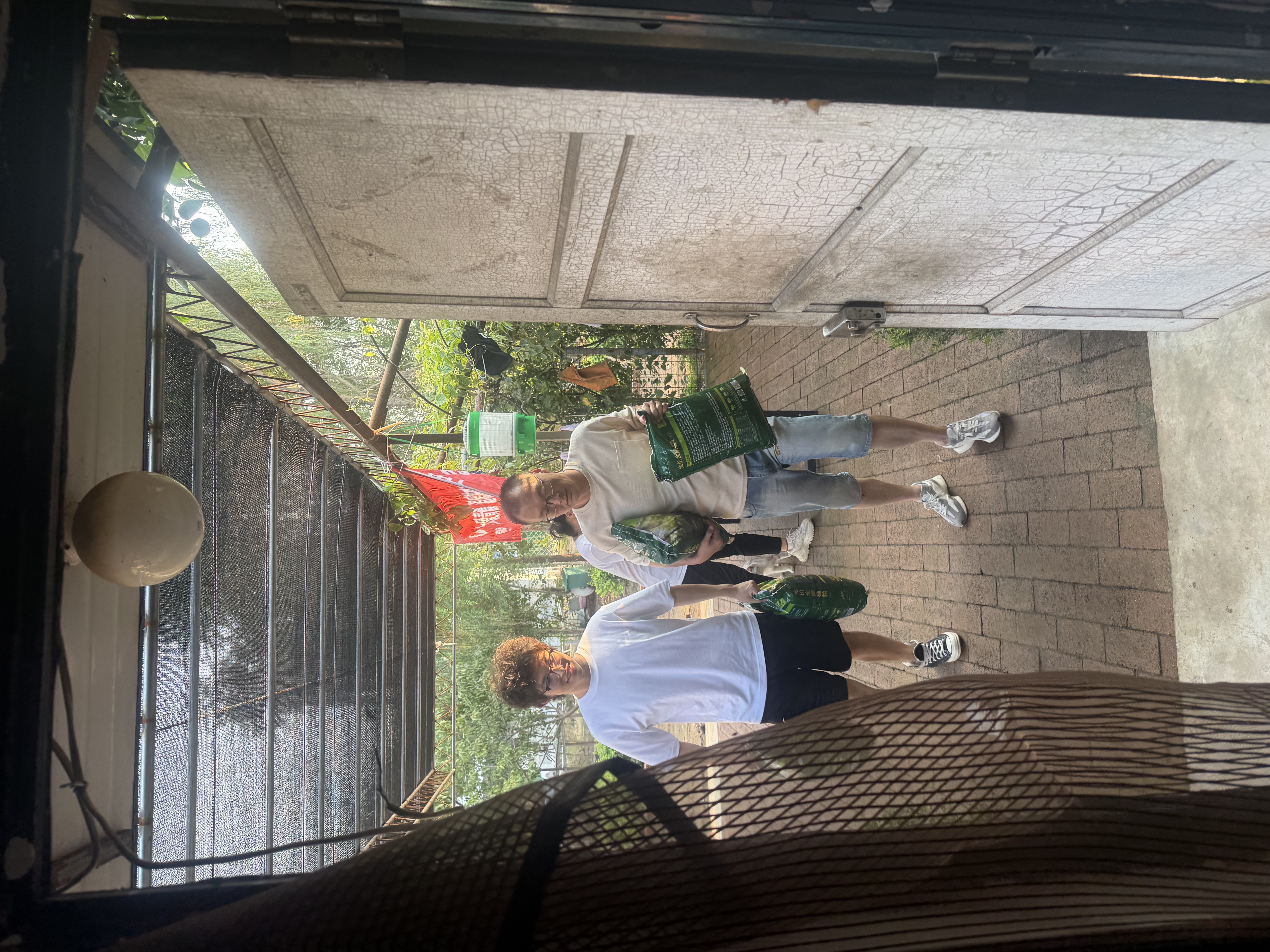 Our Team Carrying Cat Litter and Cat Food